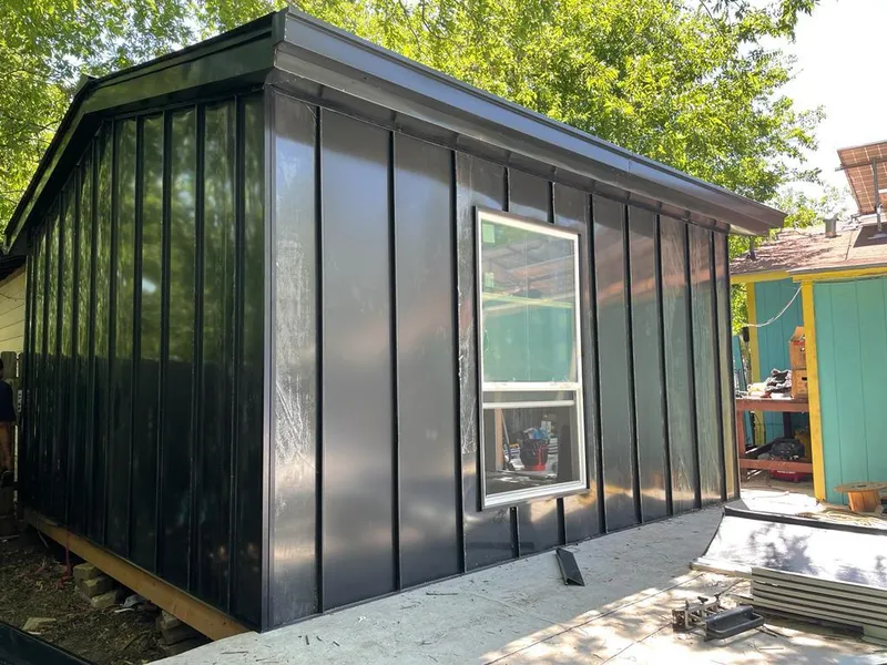 Black standing seam metal wall panels for Roof Inspection in Scio